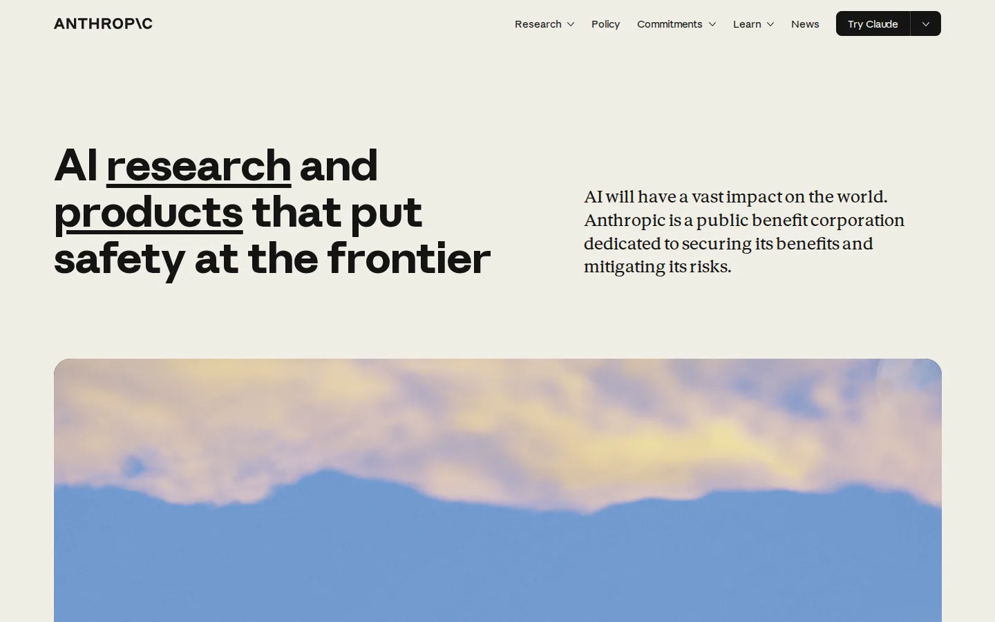 Anthropic homepage at 1440×900: off-white ground, black headline, photograph as the only colour.