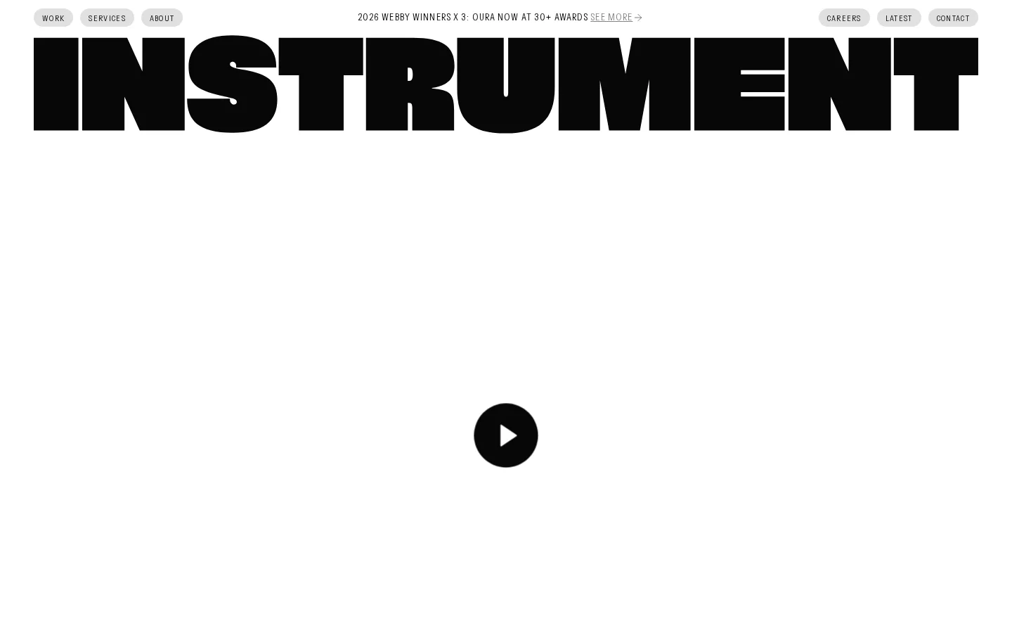 Instrument homepage at 1440×900: viewport-wide wordmark above an empty video container.