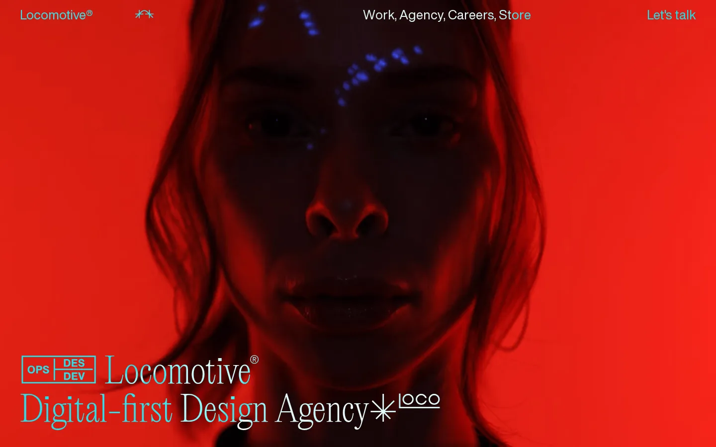 Locomotive homepage at 1440×900: red-tinted full-screen video with a cyan serif headline bottom-left.